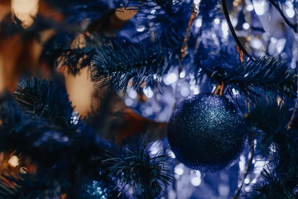 Navy blue artfiicial tree branches with navy blue matte glitter bauble 