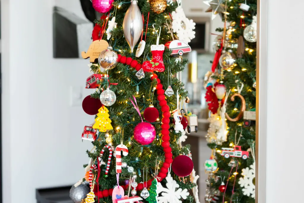 pencil christmas tree with miltui-color decorations showing maximalist Christmas decor ideas